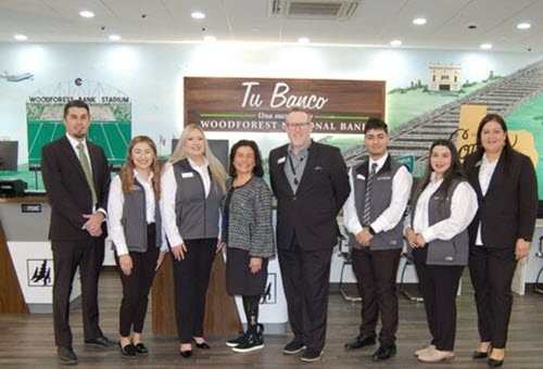 Pictured from left are Woodforest National Bank representatives Josh Fowler, Vice President, Regional Manager - Retail; Jennifer Gonzalez, Retail Banker; Ashley Crisp, Branch Manager; Julie Mayrant, President and Chief Retail Officer; Mike White, Divisional Manager, Executive VP – Retail; Cristian Lopez, Retail Banker; Jody Mendez, Retail Banker; and Christina Ochoa, Assistant Vice President, Market Manager.